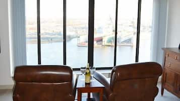 Deluxe Apartment, 1 Bedroom | Living room | Flat-screen TV, DVD player