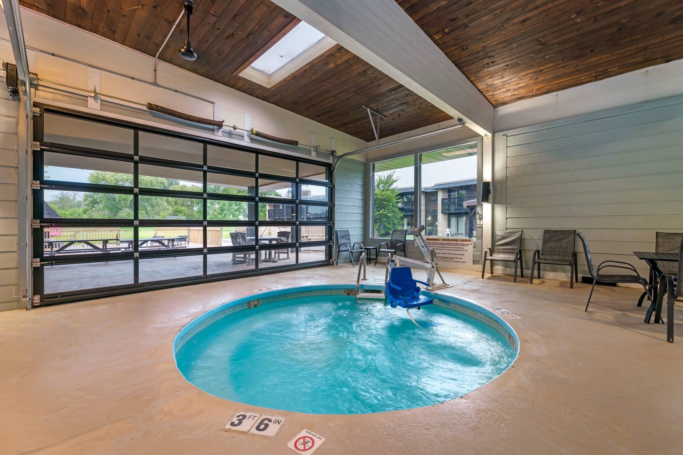 Indoor pool, open 7:00 AM to 10:00 PM, pool umbrellas, sun loungers