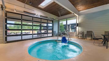 Indoor pool, open 7:00 AM to 10:00 PM, pool umbrellas, pool loungers