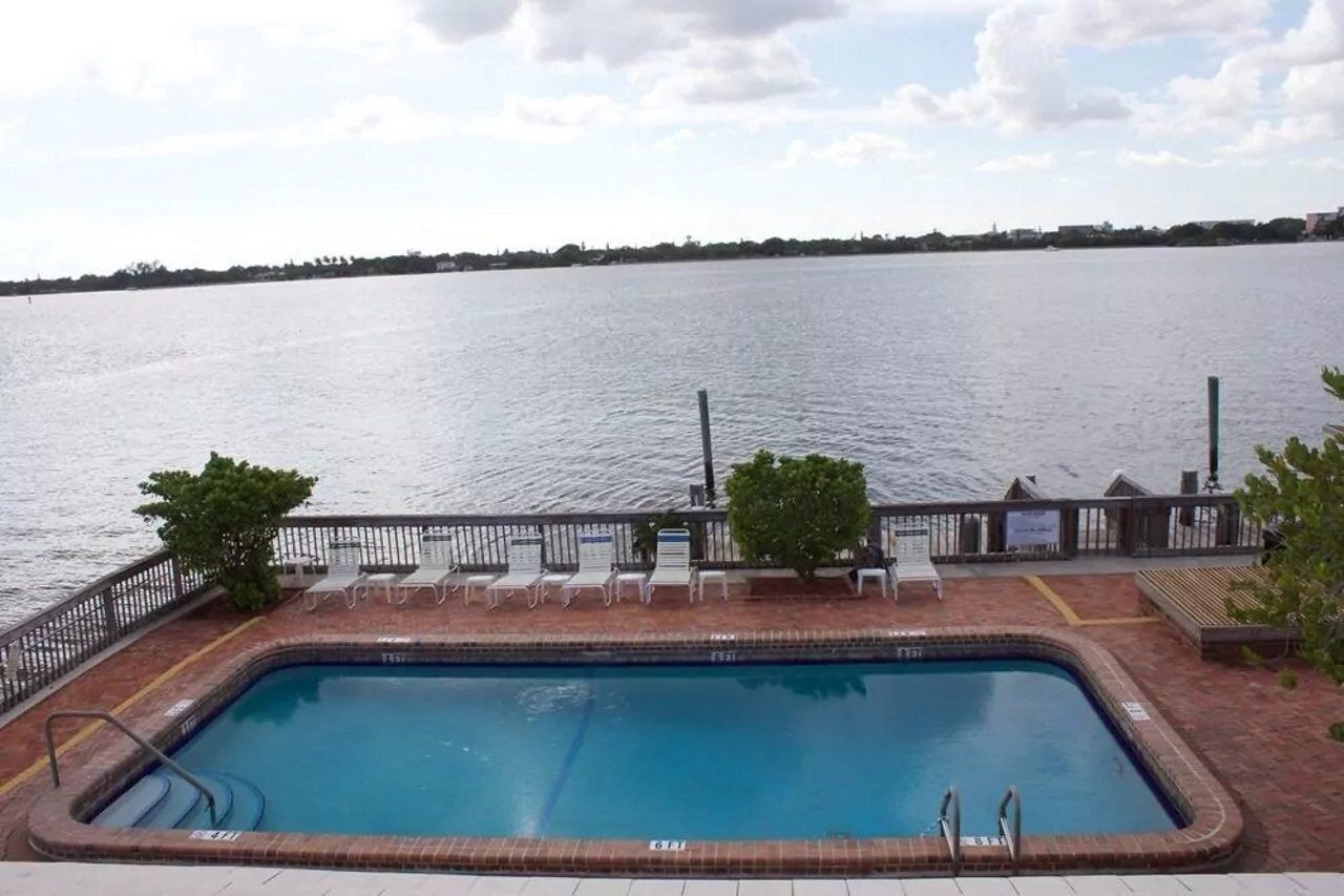 Outdoor pool, a heated pool, open 8:00 AM to 7:00 PM, pool loungers