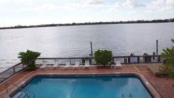 Outdoor pool, a heated pool, open 8:00 AM to 7:00 PM, pool loungers
