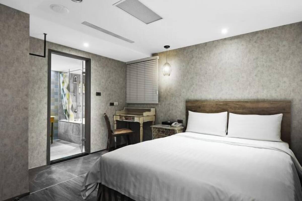 Premium bedding, desk, laptop workspace, blackout curtains