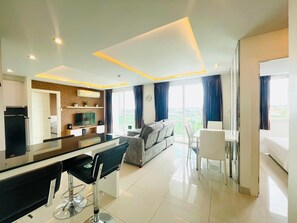 Condo | Living area | 32-inch flat-screen TV with cable channels, LCD TV