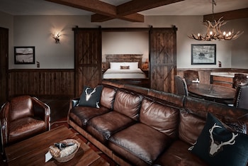 Junior Suite | Pillowtop beds, minibar, in-room safe, individually decorated at Big Cypress Lodge