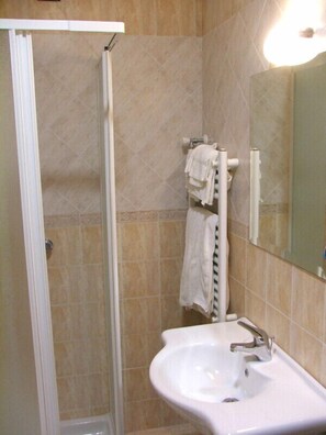 Shower, free toiletries, hair dryer, slippers