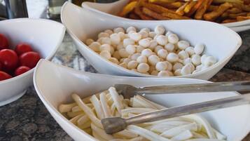 Bowls of food items on a table.