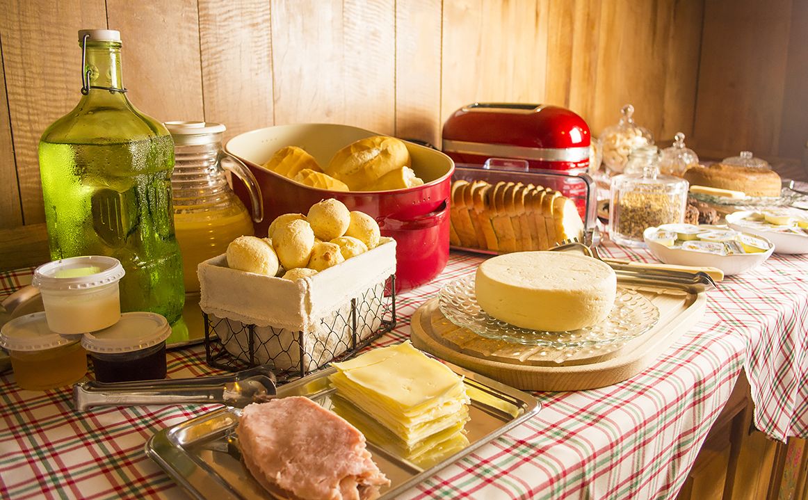 A breakfast buffet with various food items and condiments.