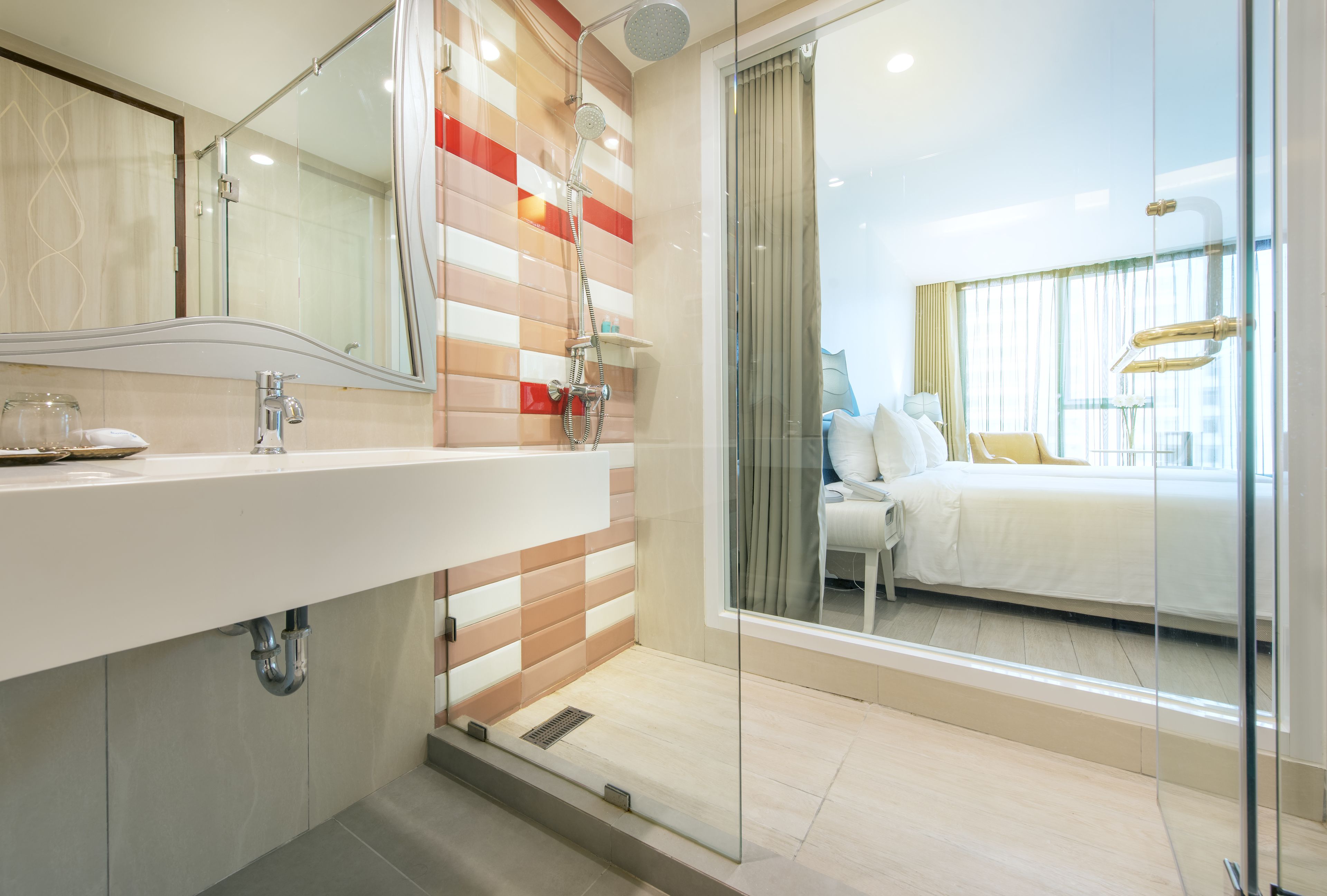 deluxe double or twin room | bathroom | shower, rainfall showerhead, hair dryer, bathrobes