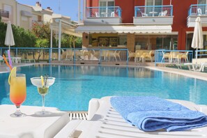 Outdoor pool, open 10:00 AM to 10:00 PM, pool umbrellas, sun loungers