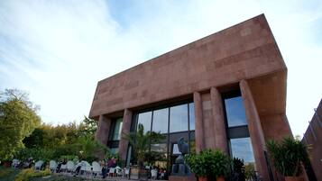 A modern building with large windows and a unique architectural design.