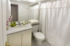 Apartment, 2 Bedrooms | Bathroom | Combined shower/tub, deep soaking tub, free toiletries, hair dryer - Ainara Apartments (Santiago)