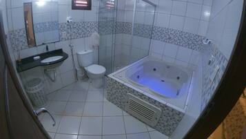 Executive Chalet, 1 Bedroom, Jetted Tub, Courtyard Area | Bathroom | Hair dryer, towels