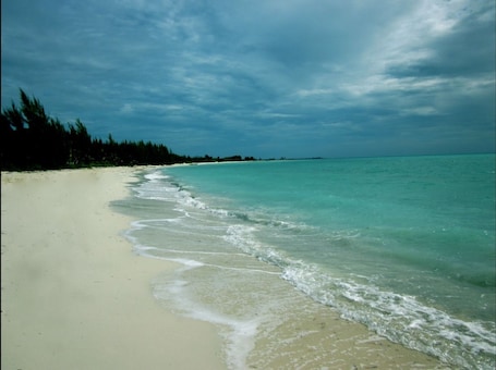 Private beach, white sand, beach umbrellas, beach towels