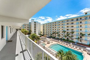 A heated pool - Cocoa Beach Corner Unit Condo. Private Balcony. Heated Pool & Hot Tub ☀️ (Cocoa Beach)