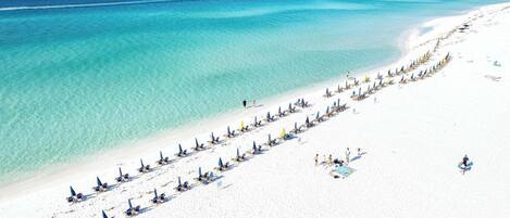 On the beach, sun-loungers