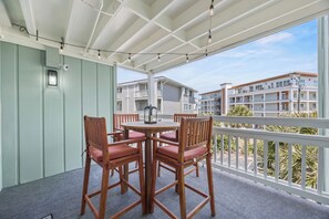 Outdoor dining - New! Coastal Condo - Pool with Marsh + Ocean Views (Carolina Beach)