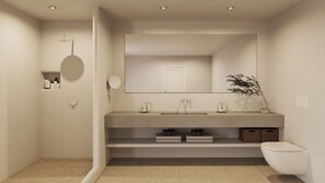 A modern bathroom with a large mirror, a toilet, and a sink. - Nero Light-filled Suites (Santorini)