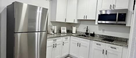 Fridge, microwave, stovetop, coffee/tea maker