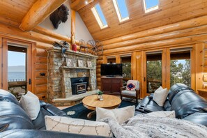 TV, fireplace - New! Lakefront Log Home | Private Dock | Indoor Hot Tub | Glacier NP | Flathead Lake | Sleeps 10 (Dayton)
