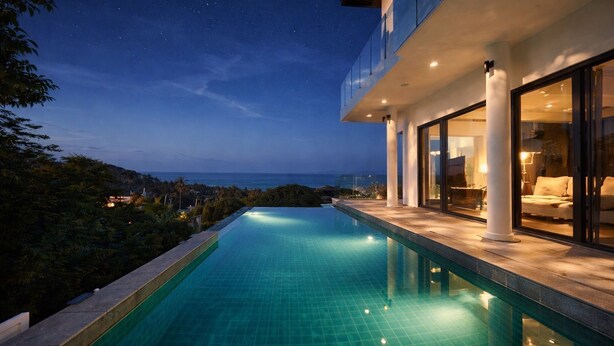 A modern poolside with a clear view of the ocean at dusk. - Bangpor Seaview Nice Villa (Koh Samui)