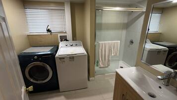Shower, hair dryer, towels, soap