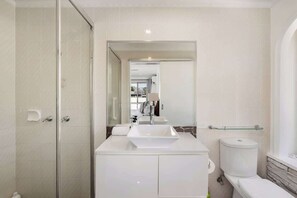 Shower, hair dryer, shampoo - Modern 3BR Home AC ThroughoutClose to Beach, Shops (Robina)
