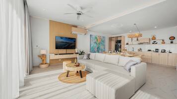 Villa Deluxe, 1 trÚs grand lit, vue mer, en front de plage | Coin séjour