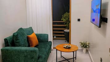 Deluxe Studio | Living area | 42-inch flat-screen TV with digital channels