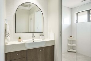 Shower, towels, shampoo, toilet paper