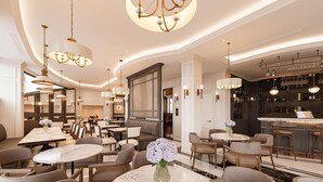 A luxurious hotel lobby with multiple seating areas, elegant chandeliers, and a bar with a wine selection. - Hotel Montmartre de Sapa (Sa Pa)