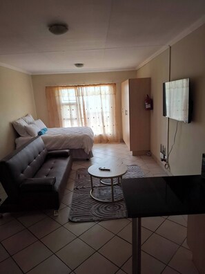 Apartment, 1 Bedroom | Living room - Serene 1-bedroom Apartment in Bloemfontein (Bloemfontein)