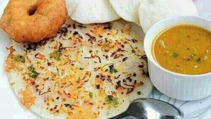 A plate with a flatbread, a fried item, and a bowl of soup. - Hotel Pardesi's Near Mansa Devi Temple (Haridwar)
