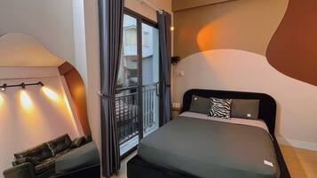 Suite estudio Deluxe, balcón, vistas a la ciudad | Ropa de cama de alta calidad, minibar, wifi gratis y ropa de cama