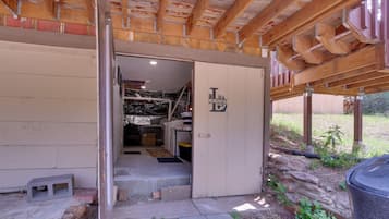A laundry facility with a door marked 'Laundry' and a visible interior including a washing machine and a drying rack.
