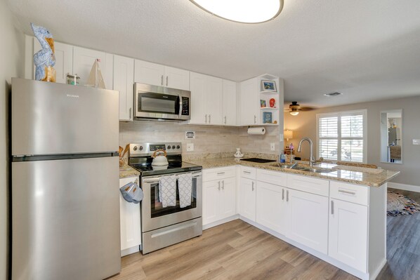 Fridge, microwave, stovetop, coffee/tea maker