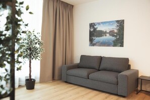 Appartement familial, vue sur le jardin | Aire de séjour