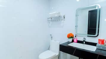 Family Triple Room | Bathroom | Shower, free toiletries, slippers, towels