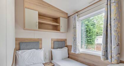 Gold Caravan. With parking and decking.