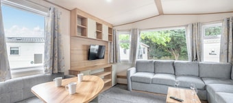 Gold Caravan. With parking and decking.