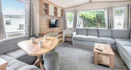 Gold Caravan. With parking and decking.