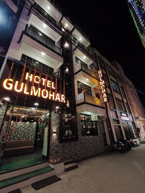 A multi-story hotel with a prominent 'Hotel Gulmohar' sign. - Hotel Gulmohar  (Haridwar)