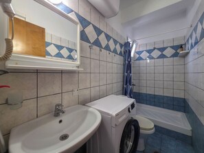 Shower, towels, soap, toilet paper