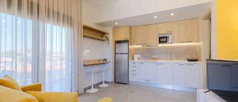 Fridge, microwave, coffee/tea maker, toaster