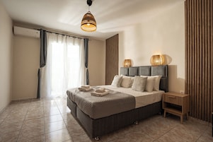 Comfort Suite, Garden View | In-room safe, desk, iron/ironing board, free WiFi