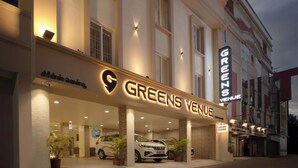 A hotel named 'Greens Venue' with a sign indicating 'Luxury Rooms' and a visible entrance. - Greens Venue (Chennai)