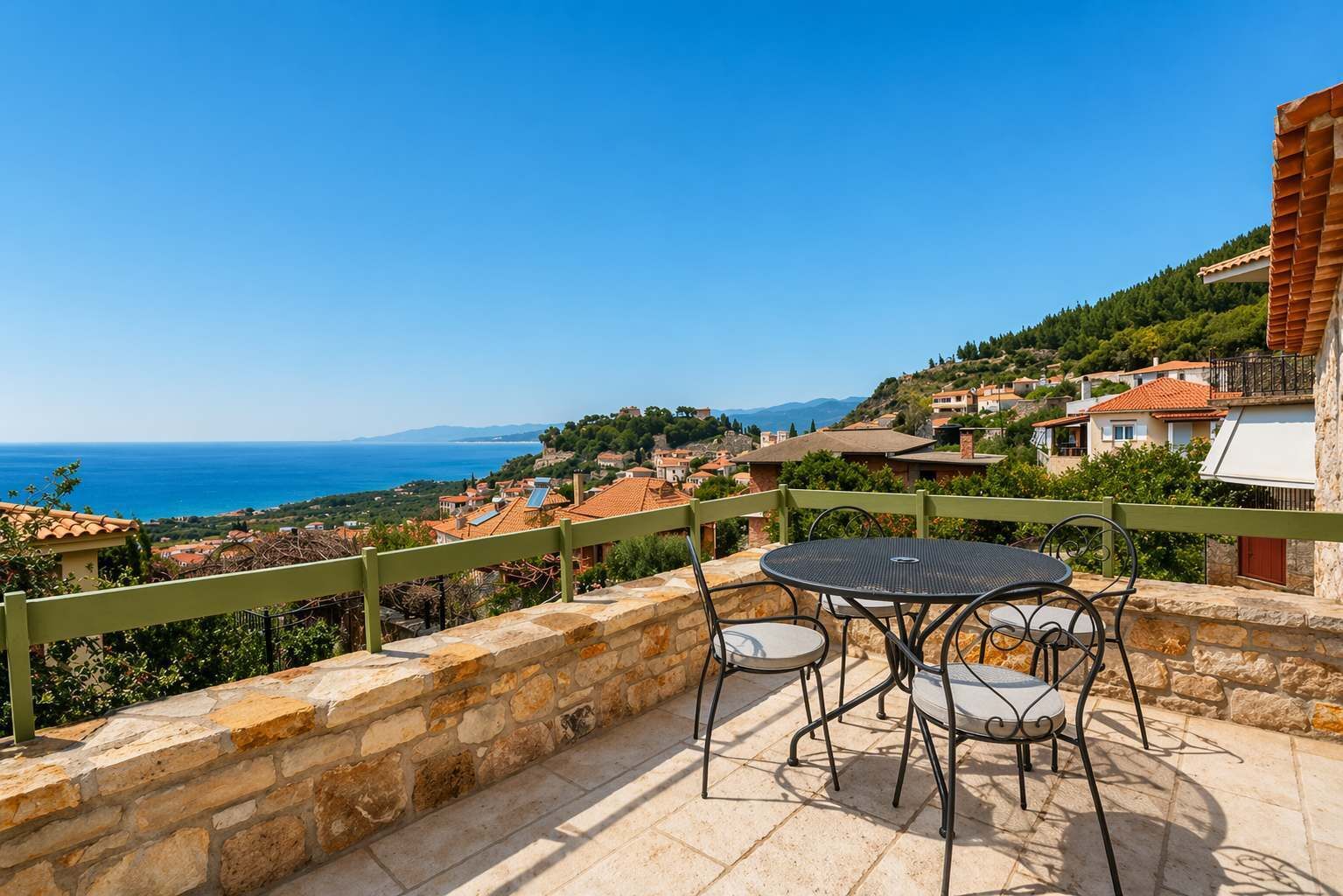 Private terrace with uninterrupted sea views, perfect for outdoor dining or relaxing at sunset.