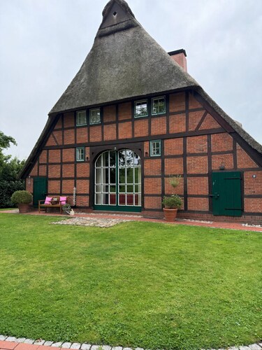 Thatched monument on the Elbe beach