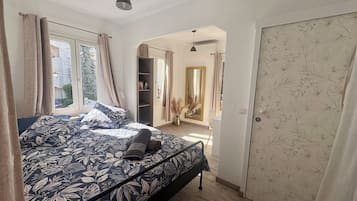 1 bedroom, desk, iron/ironing board, travel cot