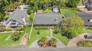 A residential area with a large house, a swimming pool, and a garage. - When Pigs Fly, Pet/Bike friendly (North Myrtle Beach)