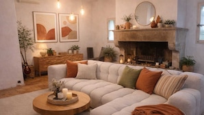 A cozy living room with a sectional sofa, a fireplace, and artwork on the wall. - Mas en Provence (Eyguières)
